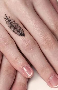 Tiny Feather Tattoo